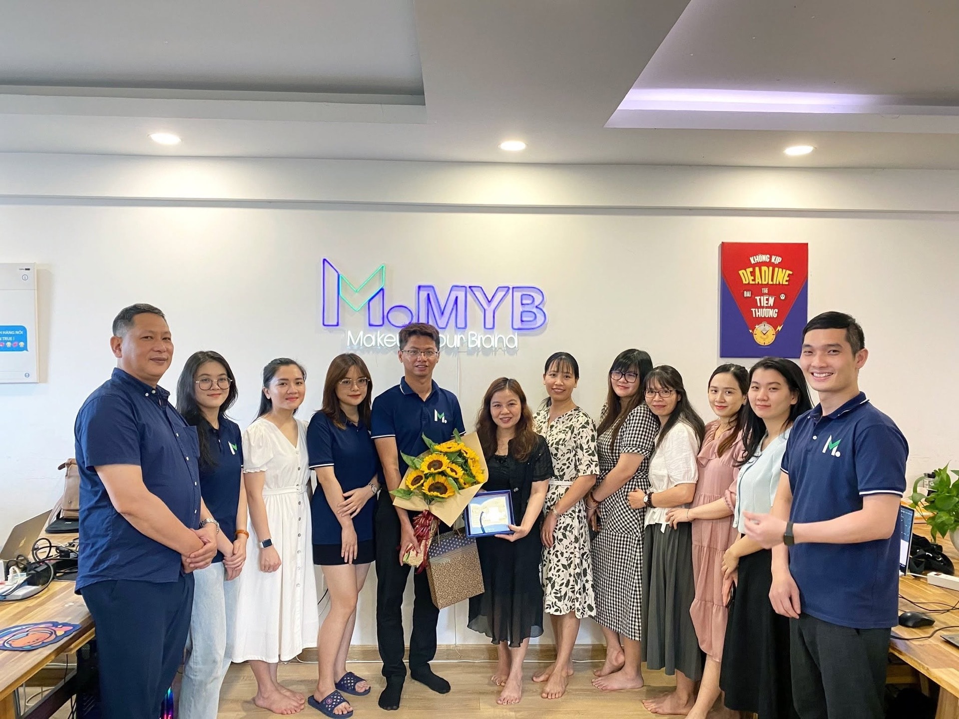Văn phòng MYB Media — logo neon Makeup your Brand